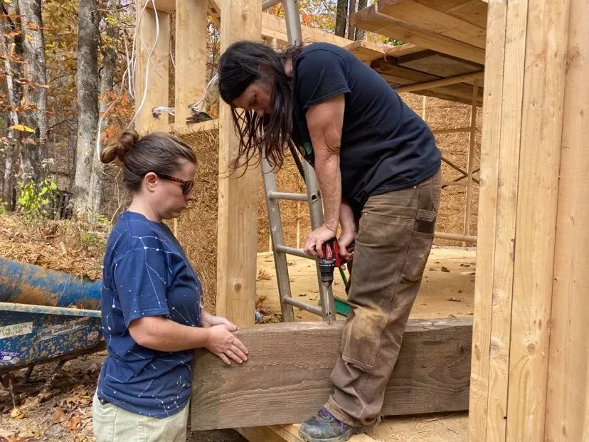 Lisa and Elizabeth helping drill through some wood!