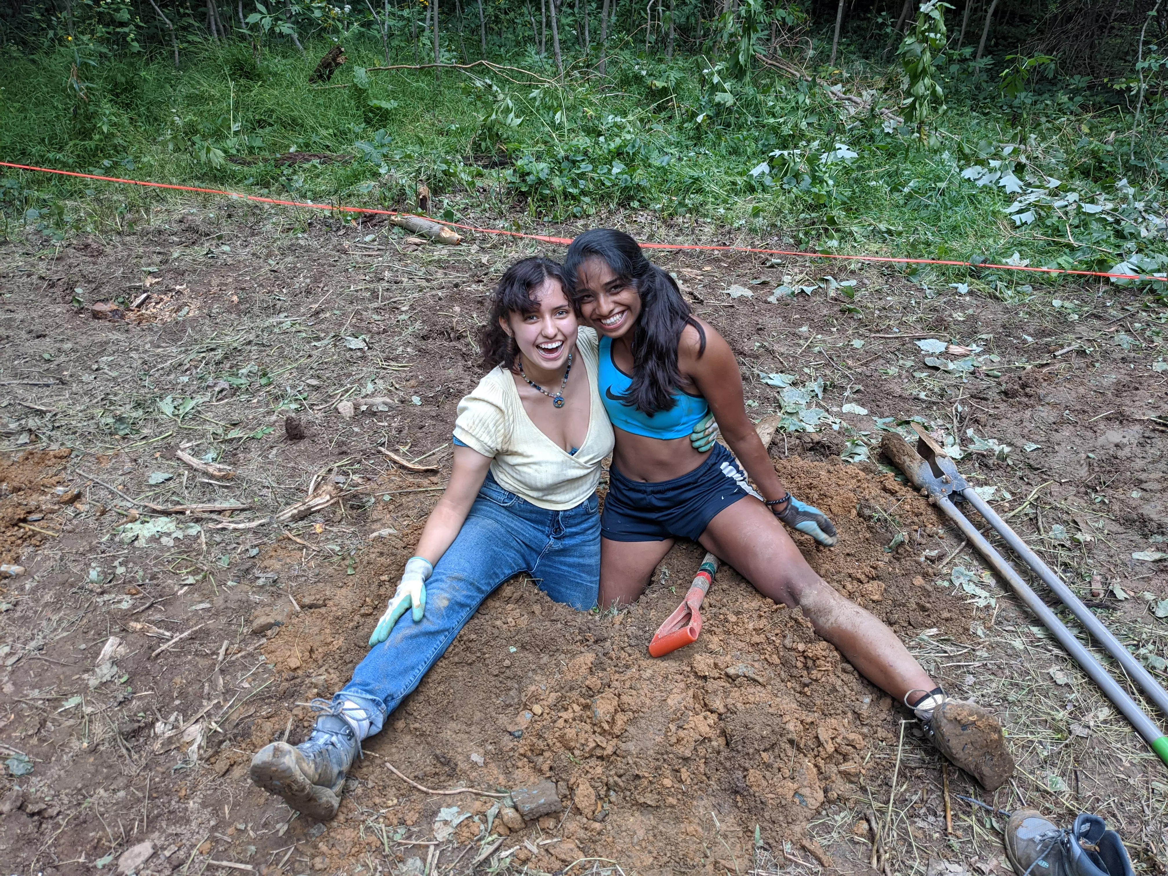 Odalys and a friend, working on digging a hole!