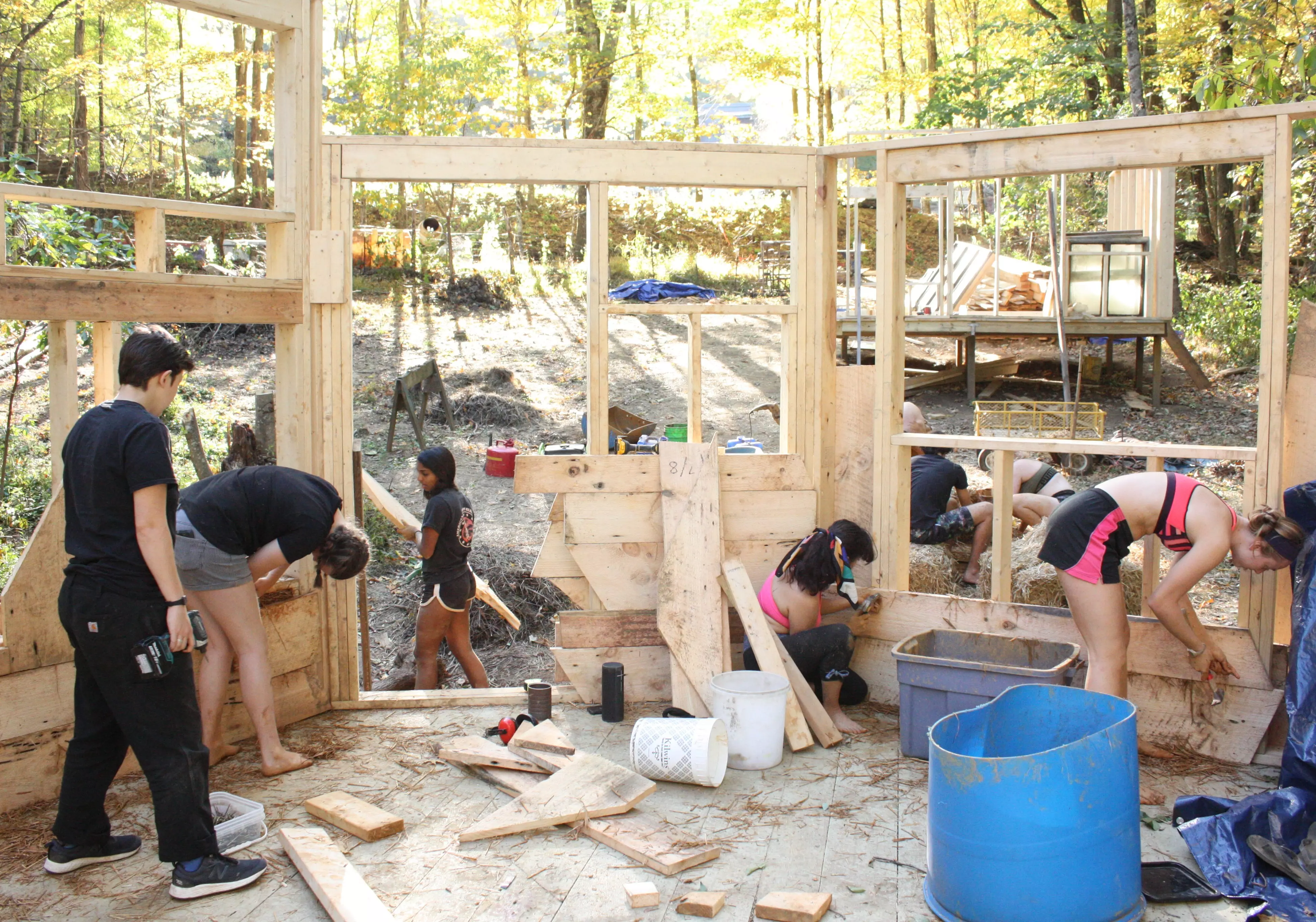 Everyone hard at work building a cabin!